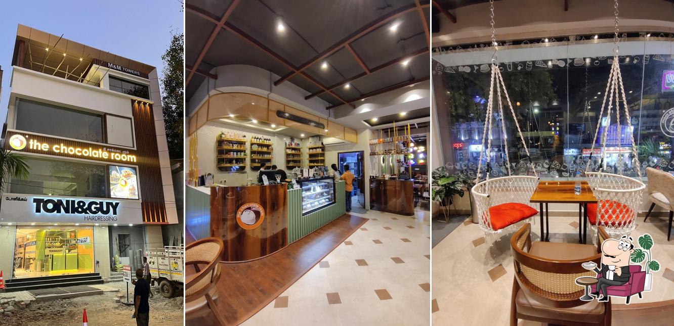 Take a seat at one of the tables at The Chocolate Room - MR Nagar