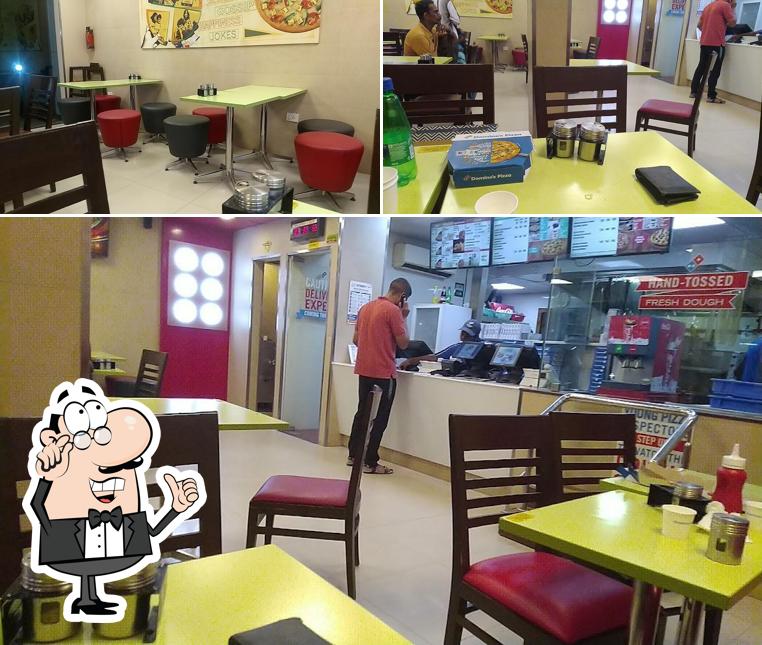 Take a seat at one of the tables at Domino's Pizza Ranganatha Nagar, Chennai