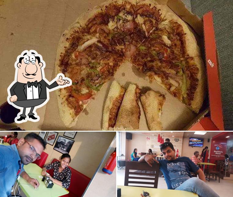 Among various things one can find interior and pizza at Domino's Pizza Pratap Vihar, Ghaziabad