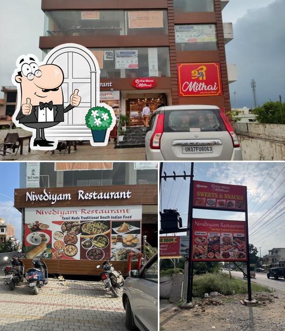 The exterior of Nivediyam Restaurant and Om Shree Mithai