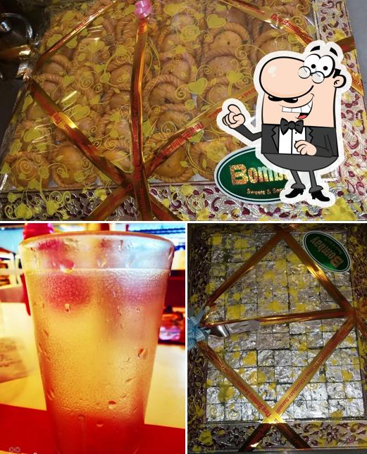 The photo of exterior and beverage at New Bombay Sweets