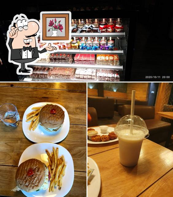 Take a seat at one of the tables at cafe kulfi (TALIPARAMBA)