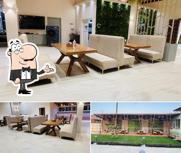 Take a seat at one of the tables at Restro Kitchen Cafe and Restaurant