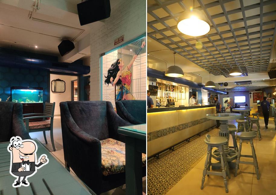 Take a seat at one of the tables at MONA CAVA CAFE AND PUB