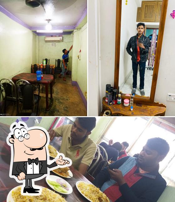 Take a look at the photo displaying interior and food at Muskan Biryani House