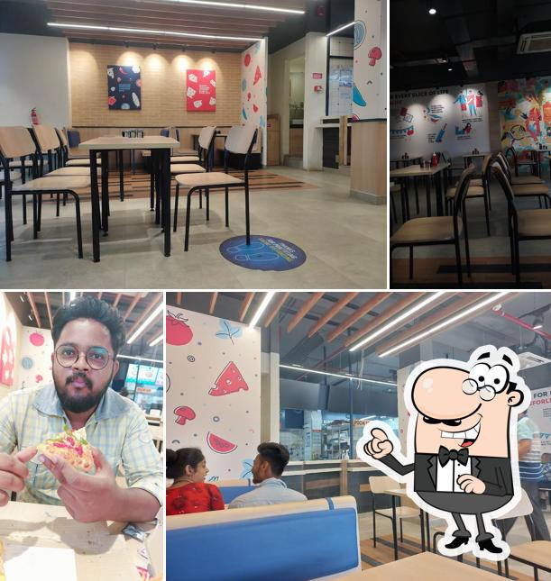 Take a seat at one of the tables at Domino's Pizza Vivekanand Marg, Balasore