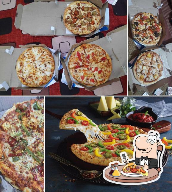Try out pizza at Dominos hut