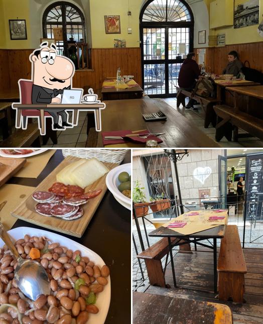 Dai un'occhiata agli interni di Osteria Il Grappolo D'Oro