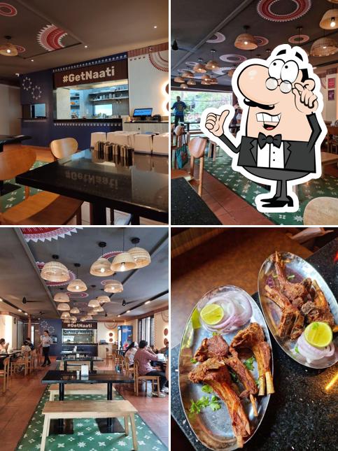 Take a seat at one of the tables at Malgudi Mylari Mane