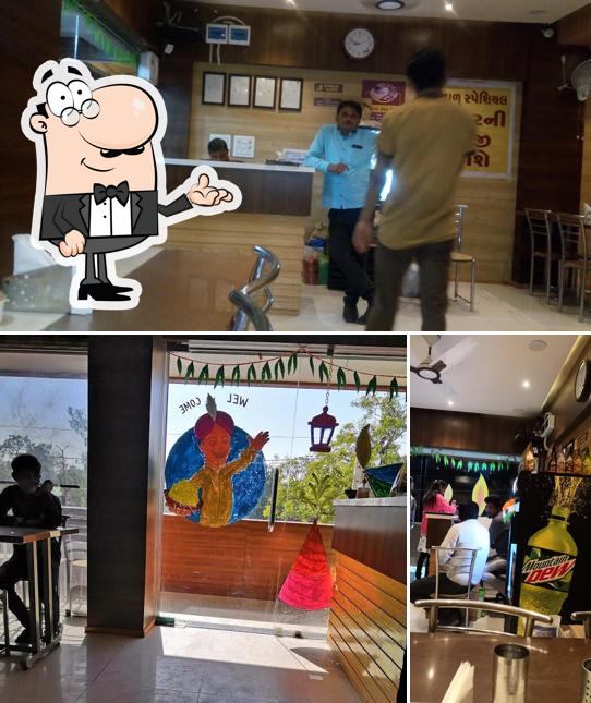 Take a seat at one of the tables at Darshan Restaurant