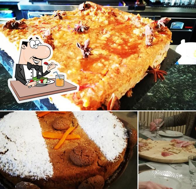 Tra le varie cose da Trattoria in piazza TIP si possono trovare la cibo e tavolo da pranzo