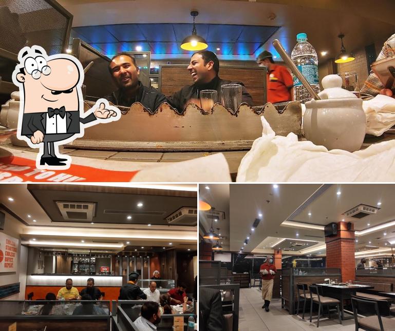 Take a seat at one of the tables at Barbeque Nation