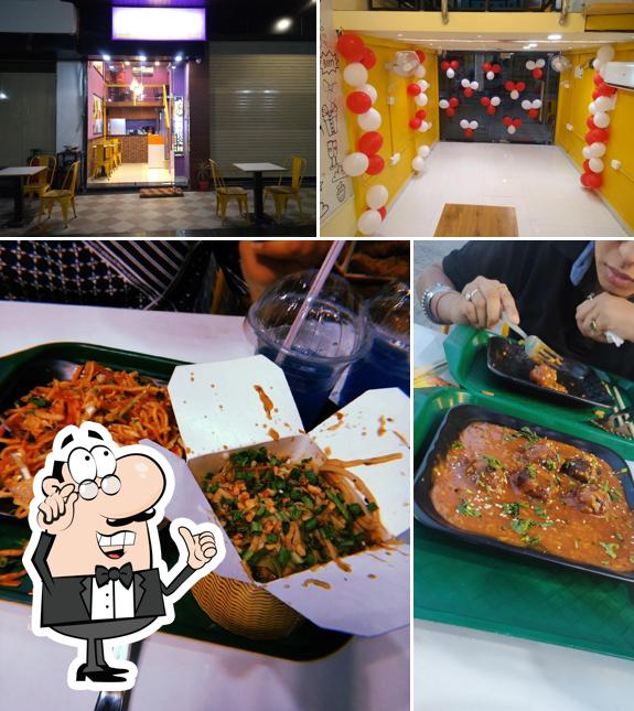 Take a seat at one of the tables at Purple Wok Co