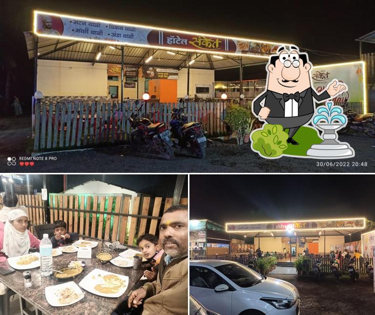 The picture of HOTEL SANKET’s exterior and dining table