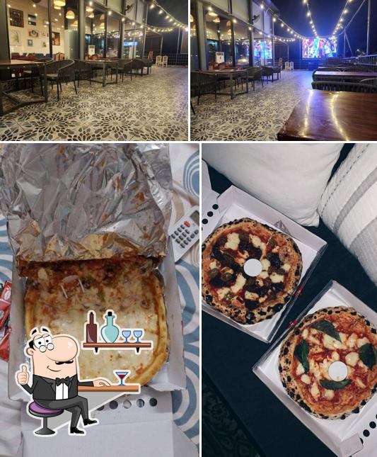 This is the picture showing interior and food at Luco Pizzeria