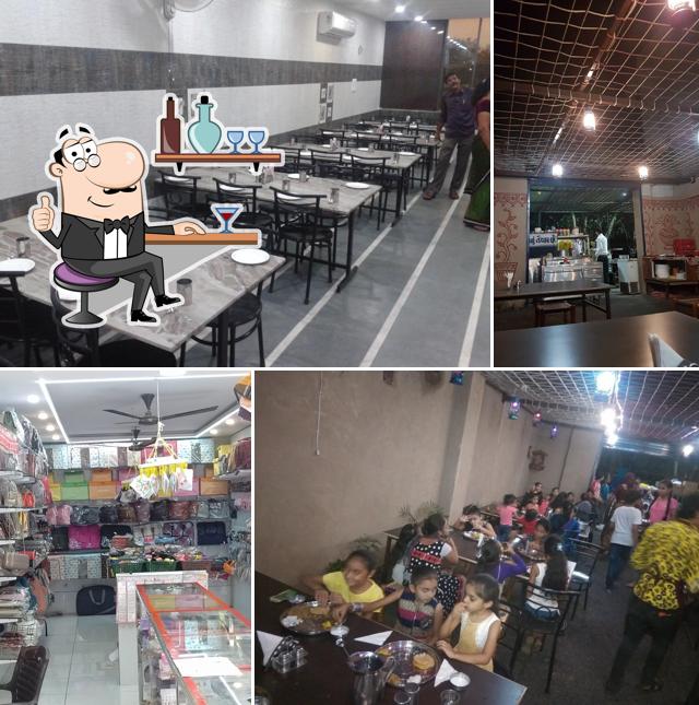 Take a seat at one of the tables at Sangeeta Restaurant