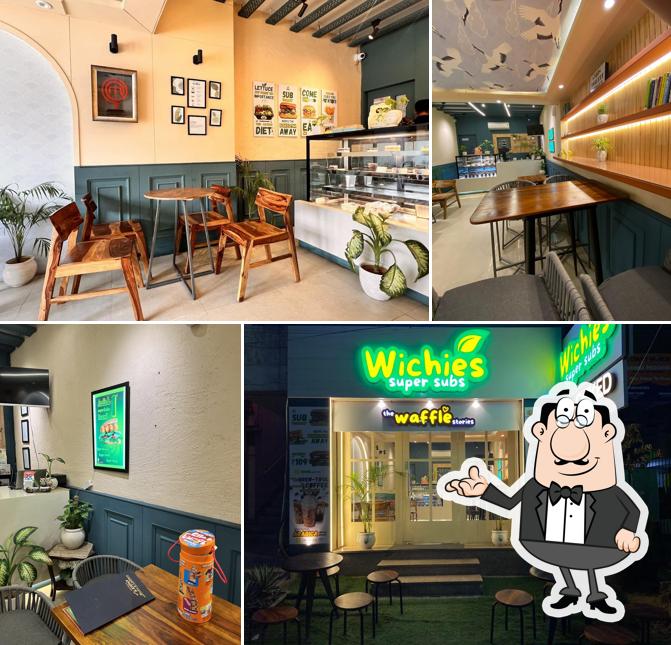 Take a seat at one of the tables at Wichies - Grilled Paninis and Sandwiches