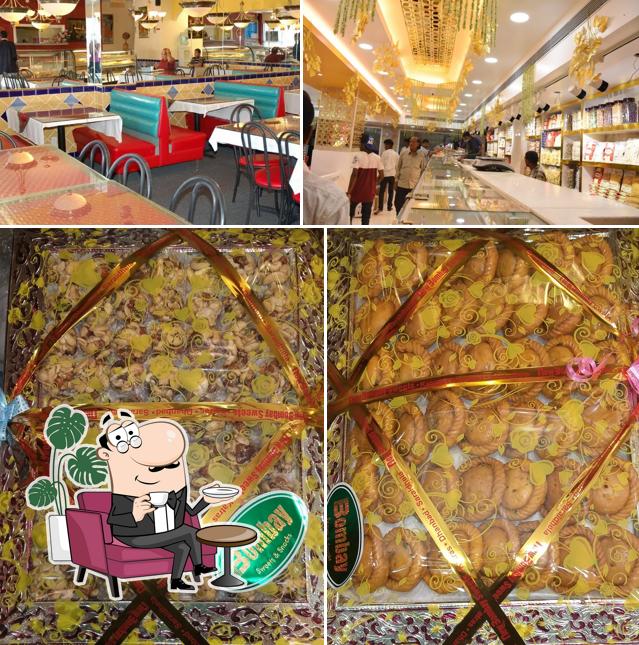 Take a seat at one of the tables at New Bombay Sweets