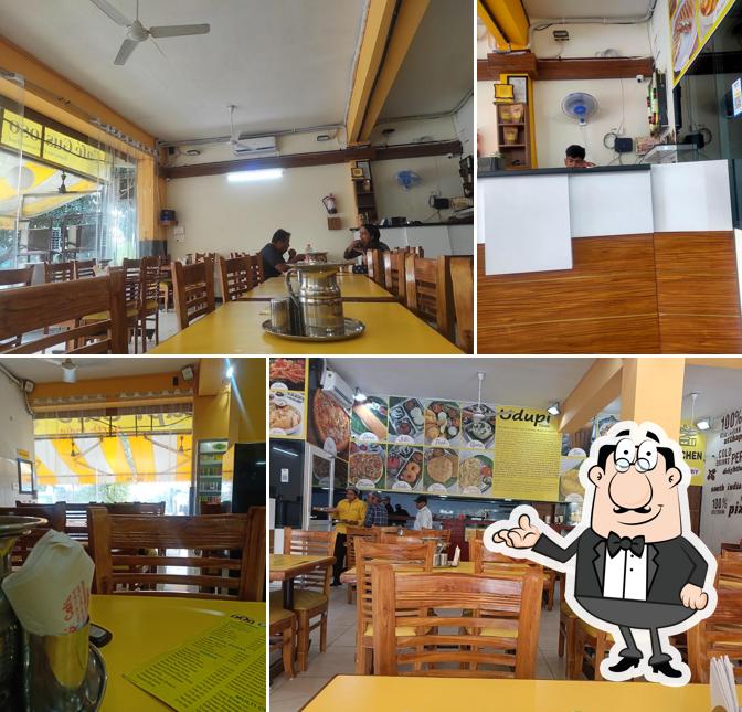 Take a seat at one of the tables at Udupi Cafe North India