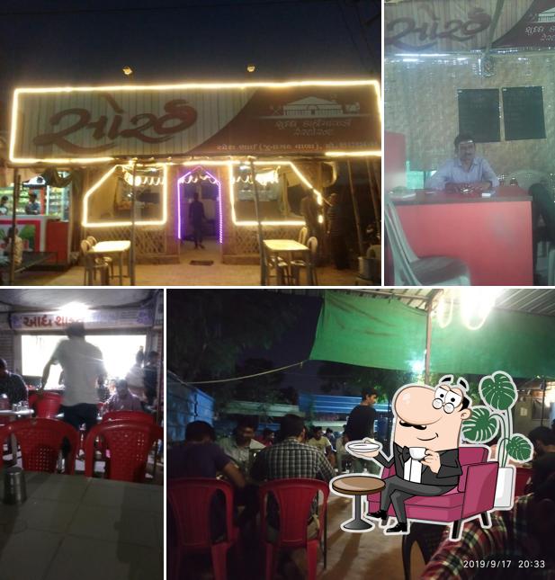 Take a seat at one of the tables at Sorath Shuddh Kathiyawadi Restaurant