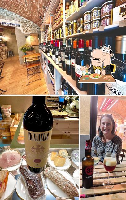 Guarda la foto che raffigura la cibo e interni di Sandrina Wine & Food Club