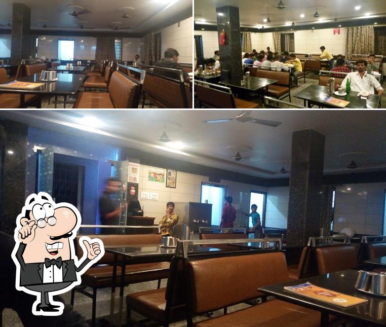 Take a seat at one of the tables at Spicy Restaurant