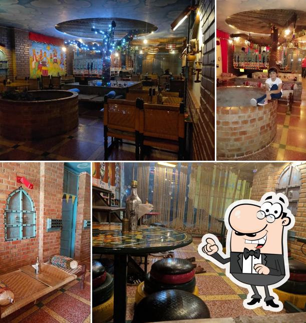 Take a seat at one of the tables at Dhaba Kulture Family Restaurant Banquet Halls Vegetarian Restaurant