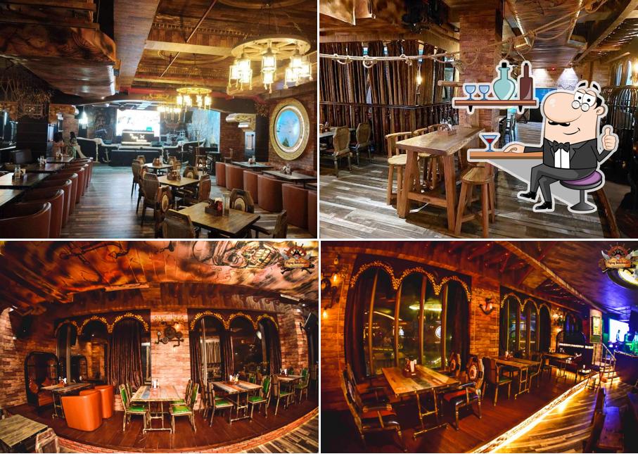 Take a seat at one of the tables at The Flying Dutchman , 5th Floor, Bhutani City Center Mall Noida Sector-32