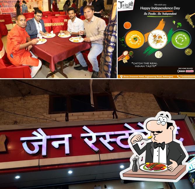 This is the photo showing food and dining table at Jain Veg Restaurant