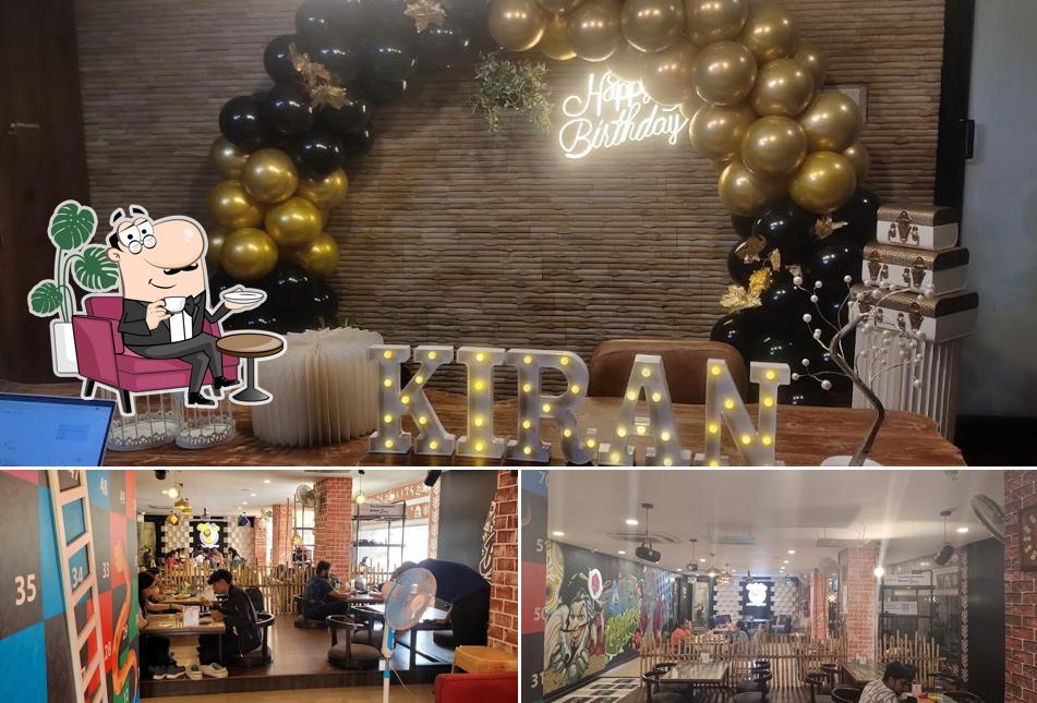 Take a seat at one of the tables at akshatha kadaba