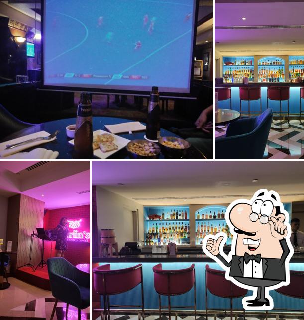 Take a seat at one of the tables at The Merlin's Karaoke Bar - The Orchid