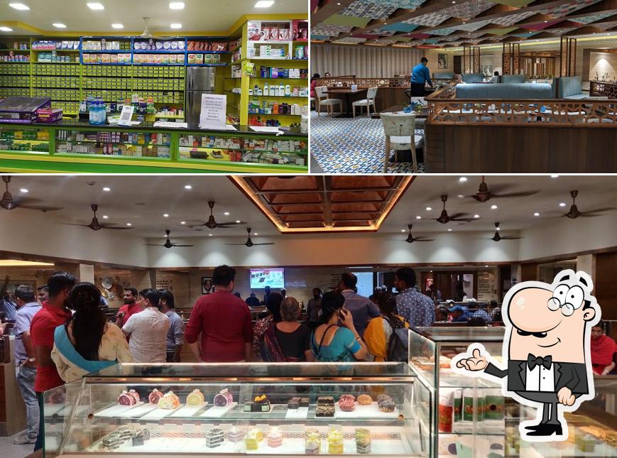 Take a seat at one of the tables at Annapoorna - R.S Puram