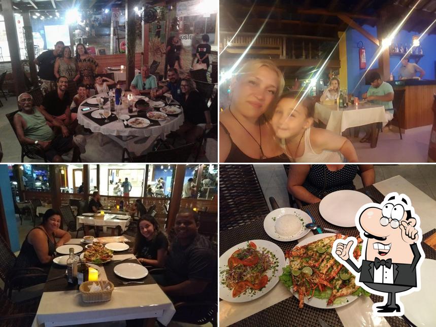 Sente em uma das mesas no Le Restaurant by La Plage