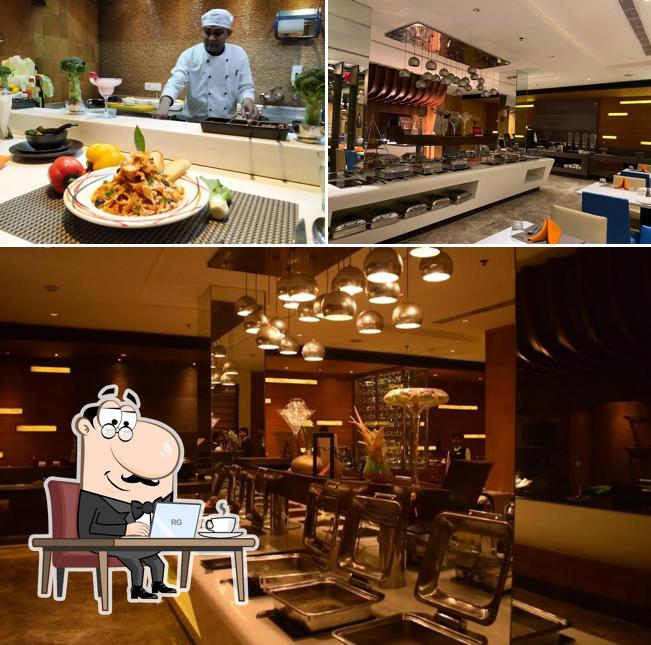 The interior of The Palate Restaurant at Ramada Plaza by Wyndham JHV Varanasi