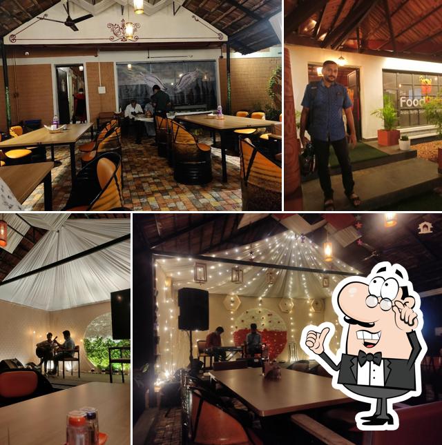 Take a seat at one of the tables at Chef's Food Planet Restaurant