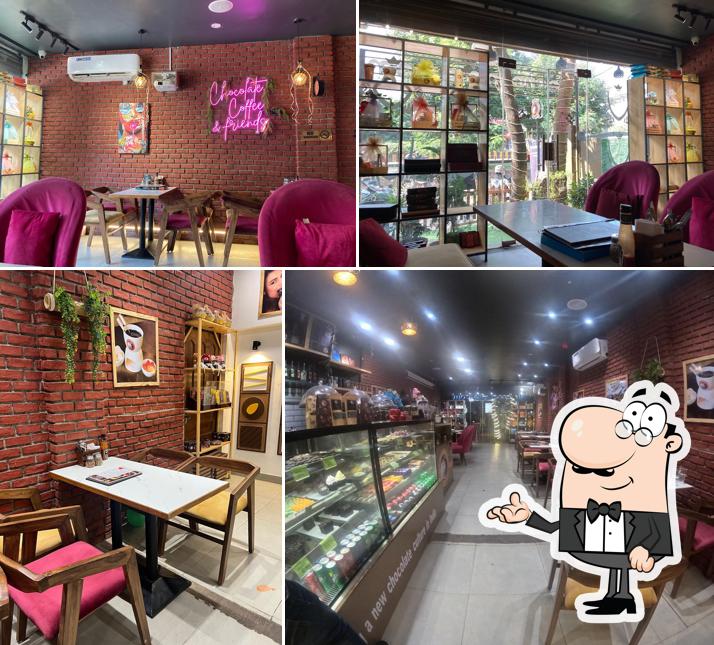 Take a seat at one of the tables at THE CHOCOLATE ROOM, JABALPUR