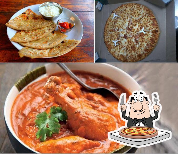 Get pizza at Mahadev Restaurant