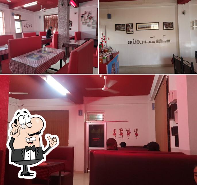 Take a seat at one of the tables at Yaotsu's Pure Veg and Non-Veg Restaurant