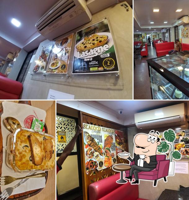 Take a seat at one of the tables at Zam Zam Restaurants YMR