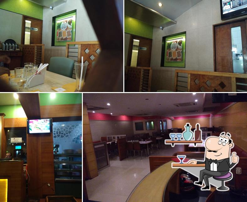 Take a seat at one of the tables at Hotel Samco Main