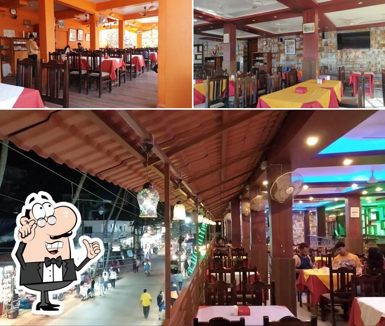 Take a seat at one of the tables at Alif Restaurant Capricorn Goa Restaurant