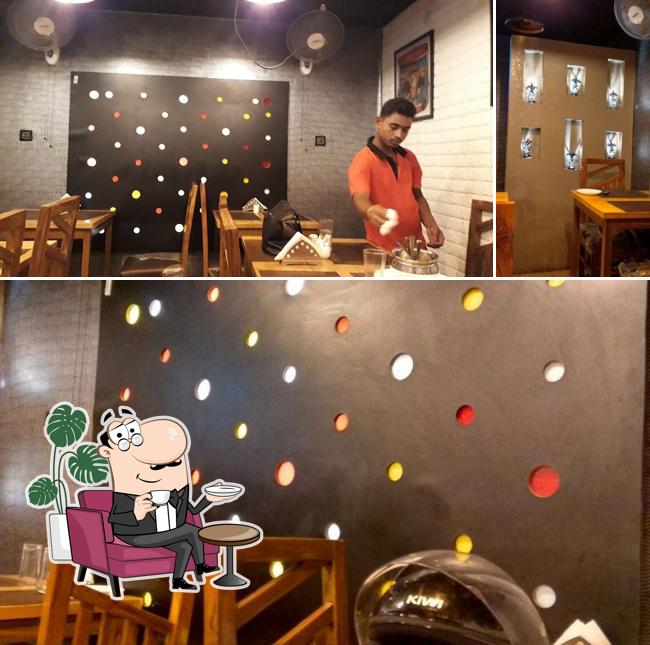 Take a seat at one of the tables at Ninth Symphony Resturant Best Resturant In Kolkata