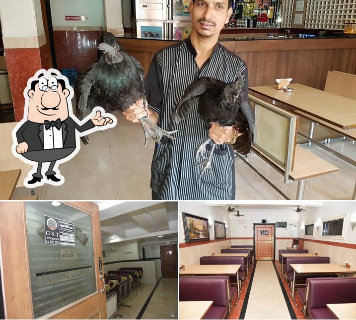 Take a seat at one of the tables at Jaika Aagri Katta And Bar