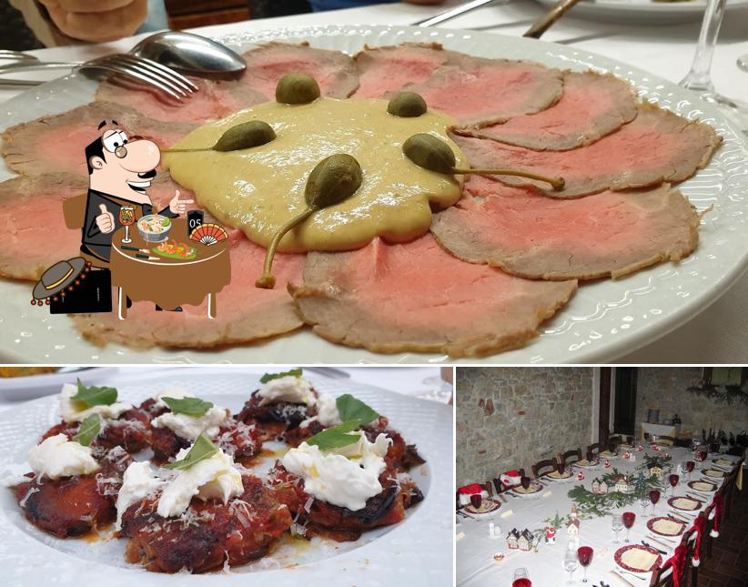 Questa è la foto che mostra la cibo e tavolo da pranzo di Trattoria Castello