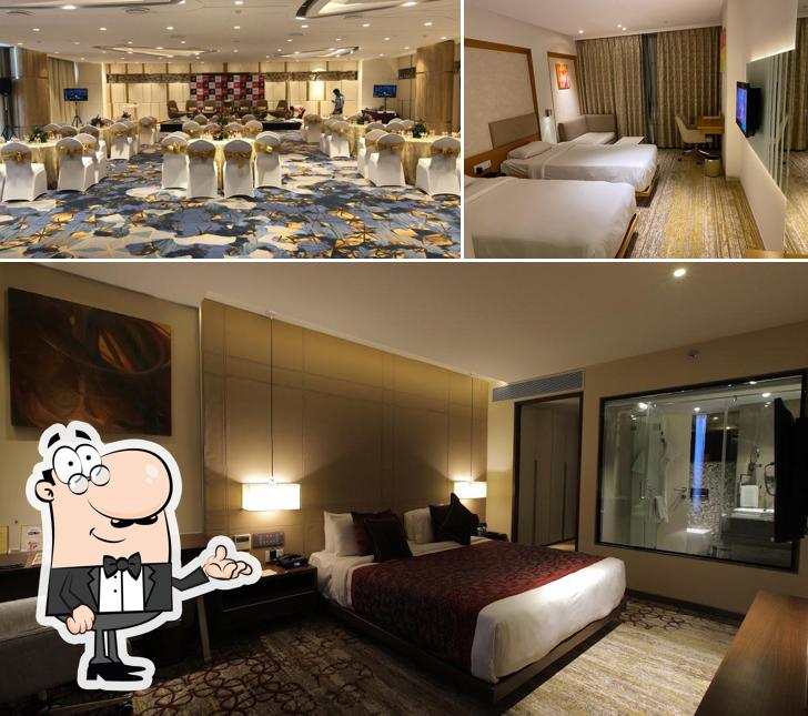 Take a seat at one of the tables at Sayaji Hotel Vadodara