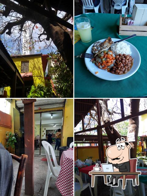 Sente em uma das mesas no Tempero de Mainha Comedoria