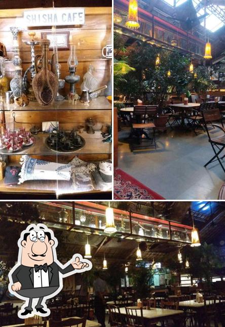 Take a seat at one of the tables at Shisha Cafe