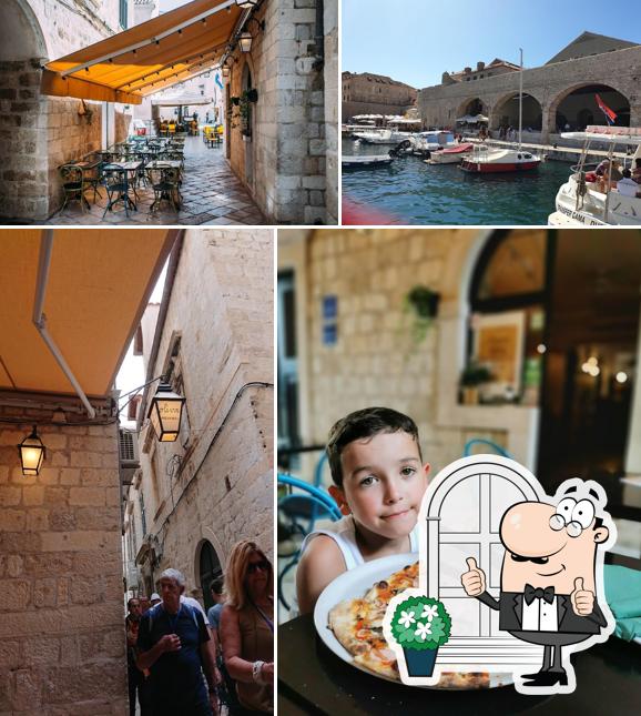 Puoi goderti l'aria fresca da seduto all'esterno di PIZZERIA OLIVA