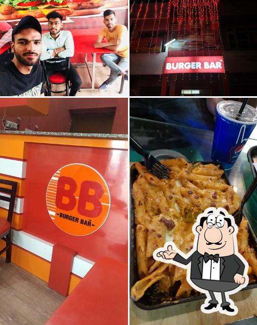 Take a seat at one of the tables at Burger Bar , sunam