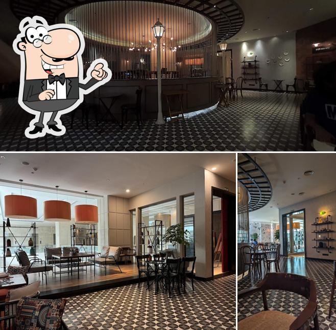 Take a seat at one of the tables at MKC - Madras Kitchen Company